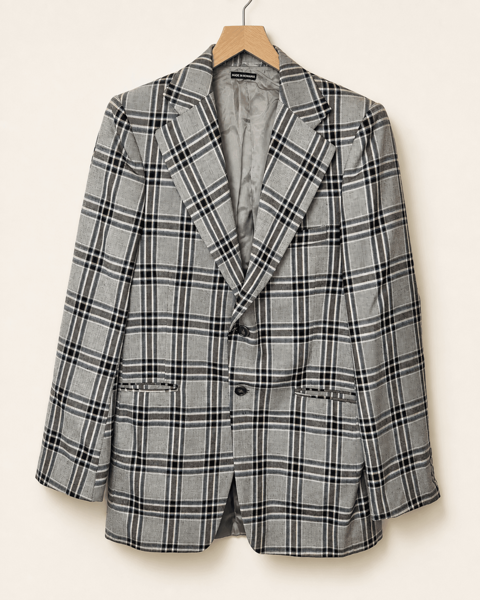Full-front preview of a light gray large-plaid sport coat on a hanger